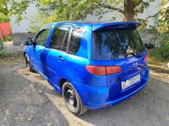 Photo of the vehicle Mazda Demio