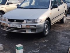 Сүрөт унаа Mazda 323