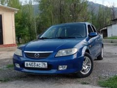 Сүрөт унаа Mazda 323