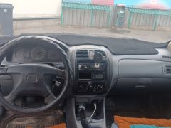 Сүрөт унаа Mazda 323