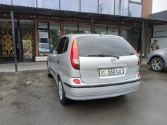 Photo of the vehicle Nissan Almera Tino