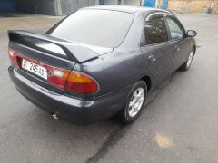 Сүрөт унаа Mazda 323