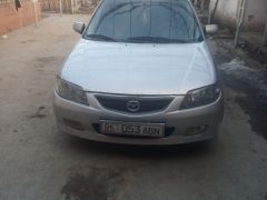 Сүрөт унаа Mazda 323