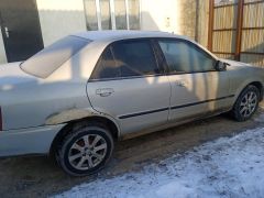 Сүрөт унаа Mazda 323