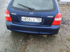 Сүрөт унаа Mazda 323