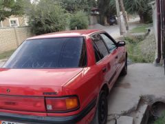 Сүрөт унаа Mazda 323