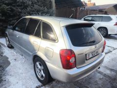 Сүрөт унаа Mazda 323