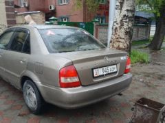 Сүрөт унаа Mazda 323