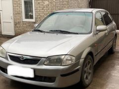 Сүрөт унаа Mazda 323