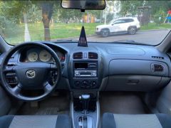 Фото авто Mazda 323