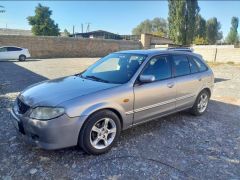 Сүрөт унаа Mazda 323