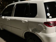 Photo of the vehicle Mazda Demio