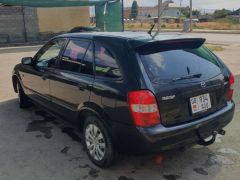 Photo of the vehicle Mazda 323