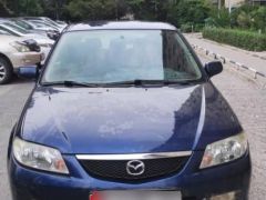 Сүрөт унаа Mazda 323