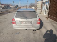 Сүрөт унаа Mazda 323