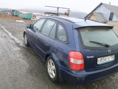 Сүрөт унаа Mazda 323