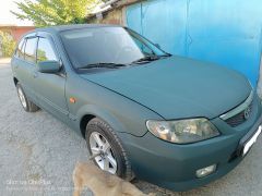 Сүрөт унаа Mazda 323