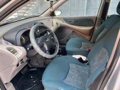 Фото авто Nissan Almera Tino