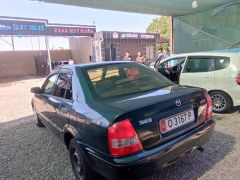 Фото авто Mazda 323