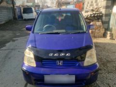 Фото авто Honda Capa