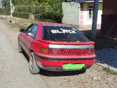 Сүрөт унаа Mazda 323