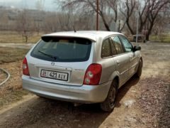 Сүрөт унаа Mazda 323