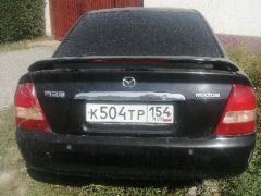 Сүрөт унаа Mazda 323