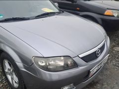 Photo of the vehicle Mazda 323