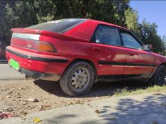 Сүрөт унаа Mazda 323