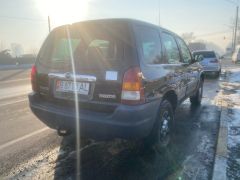 Photo of the vehicle Mazda Tribute