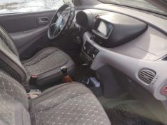 Фото авто Nissan Almera Tino