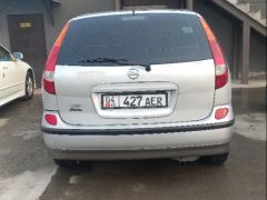 Фото авто Nissan Almera Tino