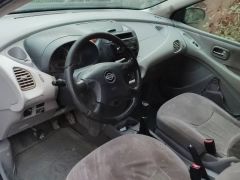 Фото авто Nissan Almera Tino