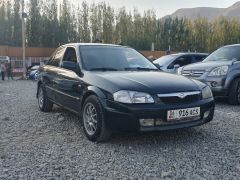 Сүрөт унаа Mazda 323