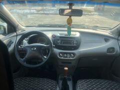 Photo of the vehicle Nissan Almera Tino