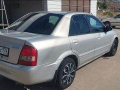 Фото авто Mazda Familia