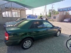 Сүрөт унаа Mazda 323