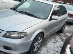 Сүрөт унаа Mazda 323