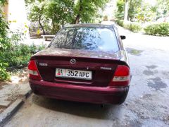 Фото авто Mazda 323