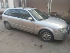 Сүрөт унаа Mazda 323