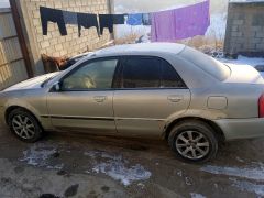 Сүрөт унаа Mazda 323