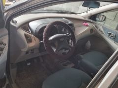 Сүрөт унаа Nissan Almera Tino