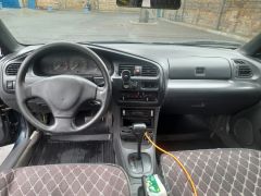 Сүрөт унаа Mazda 323