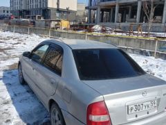 Photo of the vehicle Mazda 323