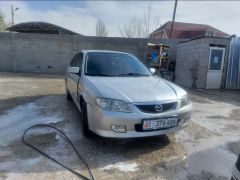 Фото авто Mazda 323