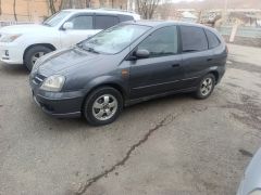 Фото авто Nissan Almera Tino