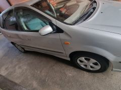 Сүрөт унаа Nissan Almera Tino