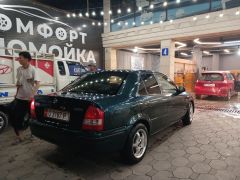 Сүрөт унаа Mazda 323