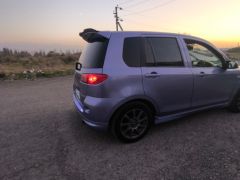 Photo of the vehicle Mazda Demio