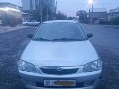 Сүрөт унаа Mazda 323